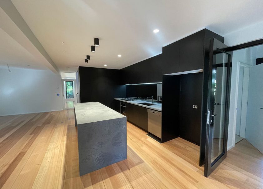 Kitchen With Black Cabinets — Aluminium Doors & Windows in Sydney, NSW